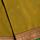 Handwoven Green Devi Consecrated cotton saree with golden beige peacock paisley design border