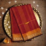 Handwoven Red Devi Consecrated cotton saree having orange and beige border with temple paisley design