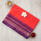 Handwoven red consecrated cotton saree with a contrasting border of purple and blue