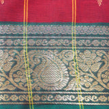 Handwoven deep red saree with shiny golden work on green border