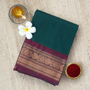 Handwoven deep green saree with a mesmerizing dark maroon border
