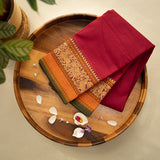 Devi Consecrated Cotton Saree – Deep Crimson Red with Golden Orange & Olive Green Traditional Woven Border