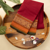 Devi Consecrated Cotton Saree – Deep Crimson Red with Golden Orange & Olive Green Traditional Woven Border