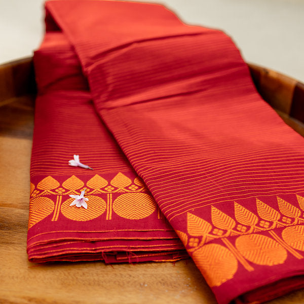 Devi Consecrated Cotton Saree – Rich Red with Fine Golden Stripes & Traditional Gold Floral Border