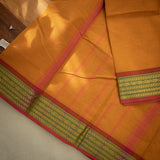 Devi Consecrated Cotton Saree – Golden Orange with Olive Green & Rust Red Woven Border