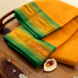 Devi Consecrated Cotton Saree – Saffron Orange with Emerald Green & Golden Woven Border