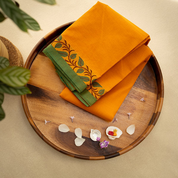 Devi Consecrated Cotton Saree – Saffron Orange with Green Border