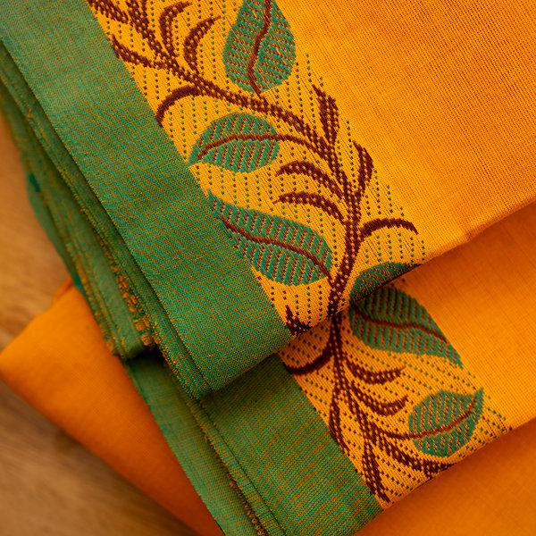 Devi Consecrated Cotton Saree – Saffron Orange with Green Border