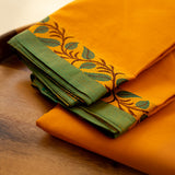 Devi Consecrated Cotton Saree – Saffron Orange with Green Border