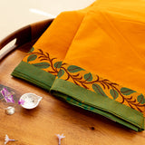 Devi Consecrated Cotton Saree – Saffron Orange with Green Border