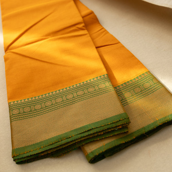 Devi Consecrated Cotton Saree – Golden Orange with Olive Green Zari Border