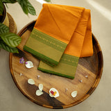 Devi Consecrated Cotton Saree – Golden Orange with Olive Green Zari Border