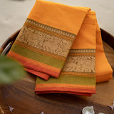 Devi Consecrated Cotton Saree – Golden Orange with Olive Green & Rust Red Traditional Floral Border