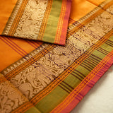 Devi Consecrated Cotton Saree – Golden Orange with Olive Green & Rust Red Traditional Floral Border