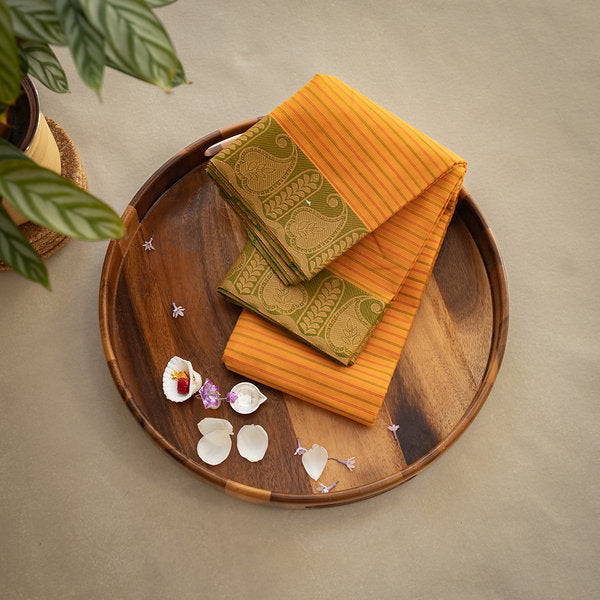 Devi Consecrated Cotton Saree – Golden Yellow with Olive Green Paisley Border