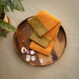 Devi Consecrated Cotton Saree – Golden Yellow with Olive Green Paisley Border