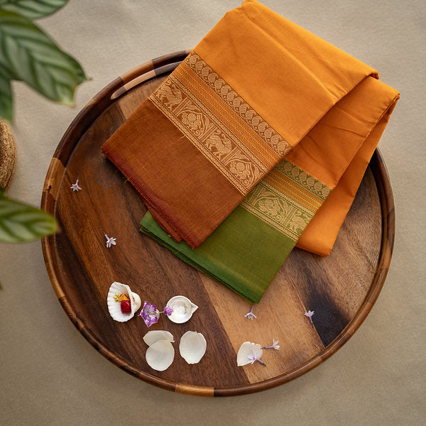 Devi Consecrated Cotton Saree – Golden Orange with Olive Green & Rust Brown Traditional Border
