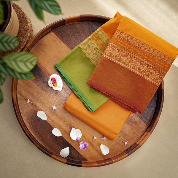 Devi Consecrated Cotton Saree – Golden Orange with Olive Green & Rust Brown Traditional Border