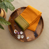 Devi Consecrated Cotton Saree – Golden Orange with Olive Green & Gold Geometric Border