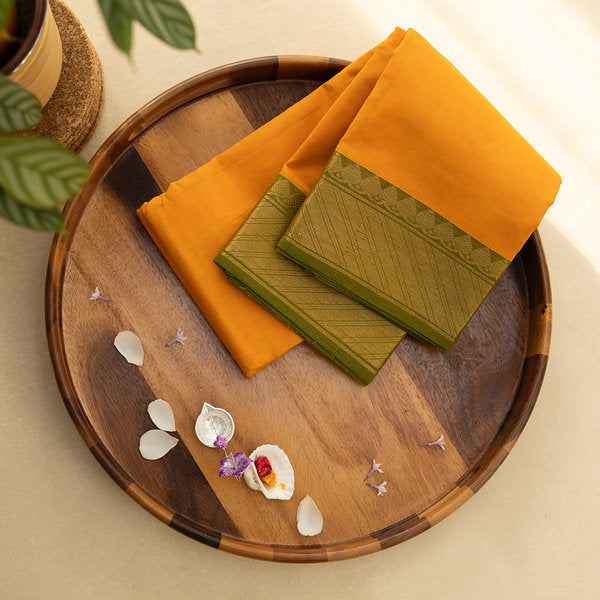 Devi Consecrated Cotton Saree – Golden Orange with Olive Green & Gold Geometric Border