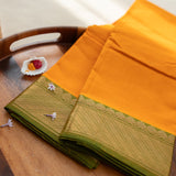 Devi Consecrated Cotton Saree – Golden Orange with Olive Green & Gold Geometric Border