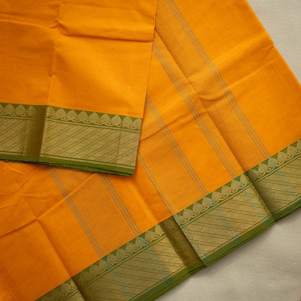 Devi Energised Cotton Saree – Golden Orange with Olive Green & Gold Geometric Border