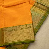 Devi Consecrated Cotton Saree – Golden Orange with Olive Green & Gold Geometric Border