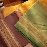 Devi Consecrated Cotton Saree – Golden Mustard Yellow with Olive Green & Chocolate Brown Traditional Border
