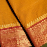 Yellow Devi Consecrated pure cotton saree with red and golden zari border with peacdock motifs and striped pallu